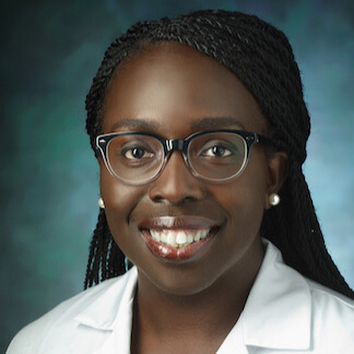 Smiling Black woman wearing glasses
