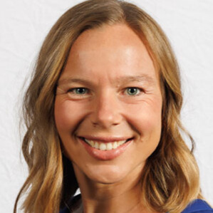 Smiling woman wearing a blue blouse