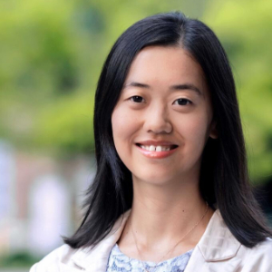 Smiling Asian woman in an outdoors setting