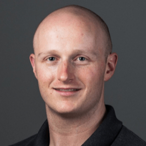 Smiling Caucasian man wearing a black polo