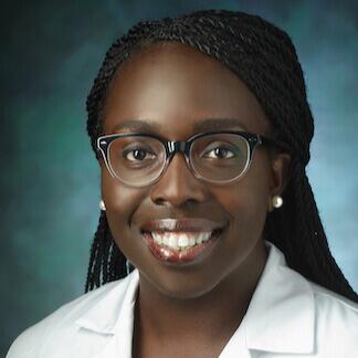 Smiling Black woman wearing glasses