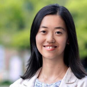 Smiling Asian woman in an outdoors setting